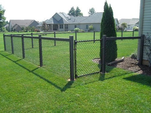 Chain link fence securing a residential backyard