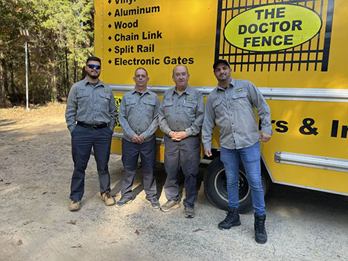 The Doctor Fence crew and completed fence work