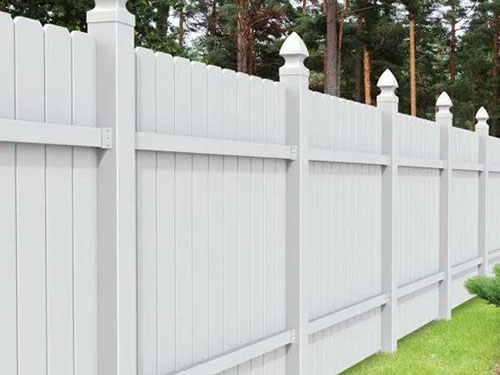 White vinyl privacy fence installed on a Charlotte-area property