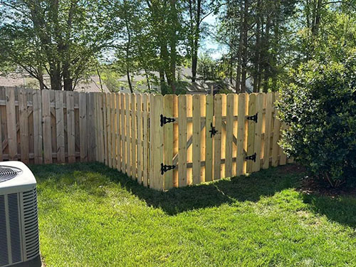 Wood privacy fence installation